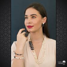 Conjunto de perlas con piedras...