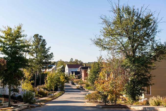 Modern walkable neighborhoods are commanding premium real estate prices in 2026., AI generated