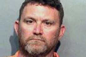 Iowa man charged in ambush murders of two cops