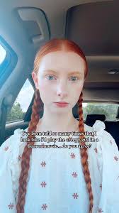 Girl with Red Hair Stops and Looks at Camera