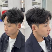 Say goodbye to flat, lifeless hair and hello to effortless volume with the  middle part perm! This look gives you gorgeous, natural waves that flow  beautifully, adding that extra bounce and texture