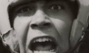 In this image from #September 1954, three Ballard High School football  players fly through the air to pounce