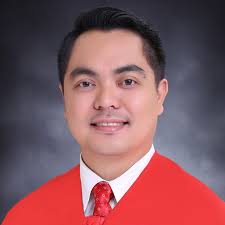 UST Rector receives first copy of 'The Education Act' from lawyer-author  Joseph Noel Estrada