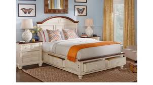 Two bed designs are available, one with a rectangular headboard top and the other with an oval shape, both finished in dark walnut. Berkshire Lake White 7 Pc King Storage Bedroom Panel Casual