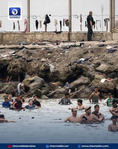 At least 67 migrants have died trying to reach European soil after tens of  thousands crossed from Morocco into Spain's enclave of Ceuta, largely by  swimming around Mediterranean frontier posts. Spanish officials