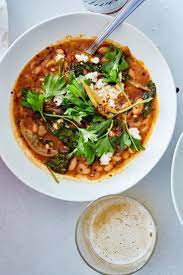 Nyt Cooking Not Quite A Fridge Clean Out Situation This Extremely Flexible Stew Can Use Up Much Of What You Ve Bean Stew White Bean Soup Broccoli Rabe Recipe