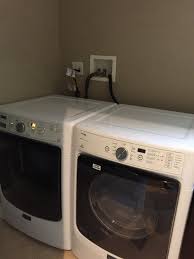 Washer and dryer hidden behind a great looking curtain. How To Hide Washer Hookups