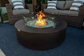 Get free shipping on qualified fire pit patio sets or buy online pick up in store today in the outdoors department. Amazon Com 42 Round Modern Concrete Fire Pit Table W Glass Guard And Crystals Set In Brown By Akoya Outdoor Essentials Clear Crystals Patio Lawn Garden