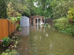 Using rain barrels under spouting to collect water in heavy rain. Raising The Level Of A Garden To Stop It Flooding Flowerpotman Landscape Gardener