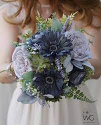 Blue flowers can also be given for birthdays, weddings and some special events. Blue And Purple Floral Bouquet Dusty Blue And Lavender Grey Etsy Purple Wedding Bouquets Blue Wedding Flowers Blue Flower Arrangements