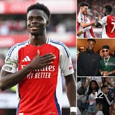 Bukayo Saka & Mikel Arteta share a moment in the dressing room, before  Arsenal lift the Premier League trophy.