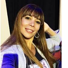 She has dark brown hair. Ximena Capristo Facebook