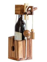 It is trapped in the puzzle until you can solve it. 7 Wine Puzzle Ideas Puzzle Wooden Puzzles Wine Bottle