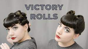 Her hair is in tight curls with straight bangs and victory rolls on the sides. More Victory Rolls On Short Hair Vintage Hair Youtube