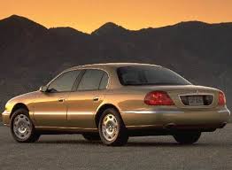 Image result for Medium Gold 1998 Town Car