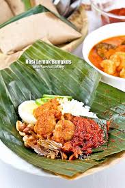 The ever popular nasi lemak bungkus served with spicy anchovies, peanuts, hard boiled eggs, and cucumber slices wrapped in banana leaves. Nasi Lemak Bungkus With Sambal Udang Malaysian Chinese Kitchen