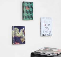 Here are some tips and ideas for coffee table displays that will make the most of form, function, and style. Umbra Conceal Vertical Display Makes Your Books Float Up The Wall