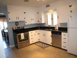 Getting rid of the wallpaper and a new floor so here's a knotty pine (w/more of a natural finish) w/the sage walls and white accents. Knotty Pine No No Knotty Pine Kitchen Pine Kitchen Cabinets Lake House Kitchen