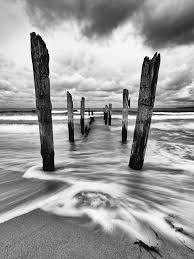 Lichtjahr21 Holzstangen Am Ostseestrand Im Abendlicht Wasserbewegung Wandbild Homedecor Einrichtung Walldecor Wallpictur Bilder Ostsee Strand Glasbilder