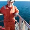 Offshore oil rig worker, mechanical technician inspecting oil centrifugal pump. 3