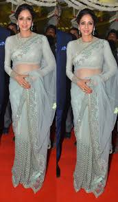 Silver embellished patch work designs bottom of the saree. Bollywood Style Sridevi In Silver Color Netted Saree Stylish Sarees Saree Wearing Styles Saree Look