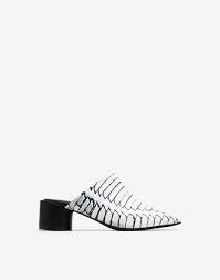Mule is a style of shoe that has no back or constraint around the foot's heel. Maison Margiela 6 Logo Heel Mules Women Maison Margiela Store