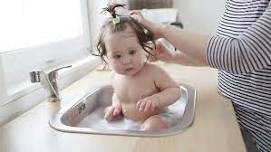 Bathing a newborn can be intimidating to say the least. Baby Taking Bath In Kitchen Stock Footage Video 100 Royalty Free 30683593 Shutterstock