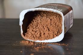 An Airtight Container Filled With Baking Cocoa Powder, Demonstrating Proper Storage.