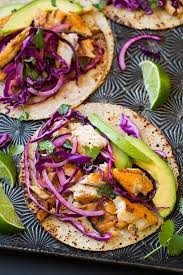 Place the grilled seasoned fish in the warm tortilla shell, top it with the crunchy, cool cilantro lime cabbage slaw, drizzle with a sauce (chipotle mayo or peruvian green sauce is nice), add avocado, cotija cheese, or grilled onions if you like. Pickled Cabbage Slaw For Fish Tacos