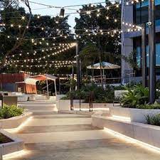 Dusk At Thelink Reveals The Overhead Catenary Lighting The Increasing Intensity Of Luminaires Architectural Lighting Design Campus Design Landscape Lighting