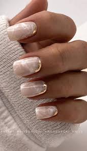 We couldn't leave out the traditional, sparkly accent nail accent nail idea #5: Creative Pretty Nail Trends 2021 Pink Marble Nails With Gold Foil