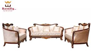 Exclusively designed and filled with romantic spirit, this beautiful sofa, loveseat and chair feature queen anne legs and carved aprons and trim, decorated with raised and scrolled floral motifs in an antique champagne finish. Banjara Hills Victorian Style Curved Sofa Set Royalzig