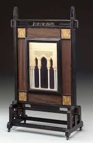 Parcial in gran diccionari de la llengua catalana, grup enciclopèdia catalana. An Aesthetic Movement Ebonized Parcial Gilt And Faux Ivory Screen