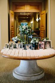 Top 12 Creative Ways To Display Photos At Your Wedding Wedding Photo Display Card Table Wedding Wedding Photo Table