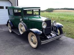 Image result for Scaraba Green 1930 Oldsmobile