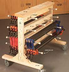 One sheet of plywood makes an easy woodworking project in the form of a pretty handy rolling clamp cart in a small footprint.read more, with links to the nyw. Double Duty Clamp Rack Woodworking Shop American Woodworker Clamp Rack Woodworking Woodworking Popular Woodworking