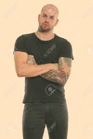 Check spelling or type a new query. Studio Shot Of Young Bald Muscular Man Standing With Tattoos Stock Photo Picture And Royalty Free Image Image 136084342