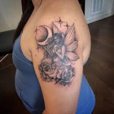 A woman is seen hugging a space, suspected to be her guardian angel. 40 Gothic Fairy Tattoos Origins Meanings Symbols