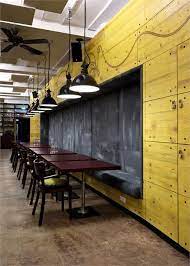 This Isn T A Bad Idea At All A Series Of Chairs And Small Tables Nested Near A White Board Or Restaurant Seating Design Restaurant Seating Restaurant Interior