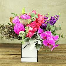 Flowers sydney have over 50 qualified florist working within our company and 9 retail outlets across sydney and deliver high quality flowers at competitive prices. Box Of Exotic Pink Purple Flowers Flowers For Everyone