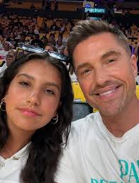 Eric with his mom, son, and daughter in a baseball game ⚾