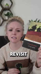 That One with A Man Holding A Old Book