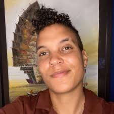 Hobbes Baya (they/them) is a soft 26, non-binary & daylights as a podcast  co-host with their collaborative partner Lindsay Parnell