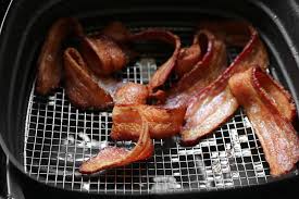You may need to tear or bend the pieces of bacon to get them to fit, depending on the size of the basket. How To Make Crispy Bacon In An Airfryer Popsugar Food Uk