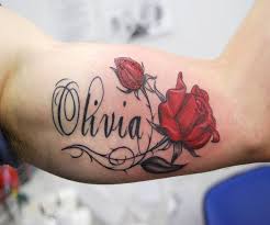 35 rose tattoos for females. Olivia Name With Red Roses Tattoo On Bicep