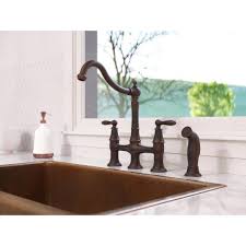 Not many kitchen faucets are able to nail both look and function the way this one does. Pfister Courant 2 Handle Bridge Kitchen Faucet With Side Spray In Rustic Bronze F 031 4cou The Home Depot