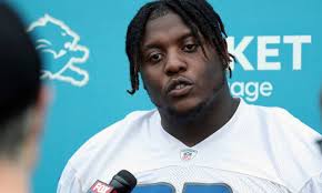 Lions DC Aaron Glenn updates the progress of rookie DT Brodric Martin