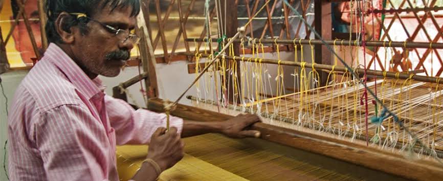 Master weaver at work in a traditional loom shed, AI generated