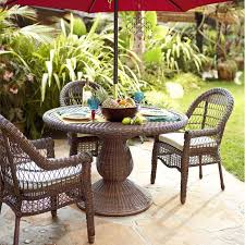 An Airy Exceptionally Comfy Traditional Outdoor Dining Chair Made Of Hand Woven Synthetic Rattan Over A Durable Du Patio Outdoor Dining Chairs Outdoor Decor