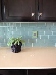 When we first saw this cute little ranch home. This Colour Scheme Dark Cabinets Teal Subway Tile White Quartz Counter Top Glass Subway Tile Backsplash Glass Tiles Kitchen Green Backsplash